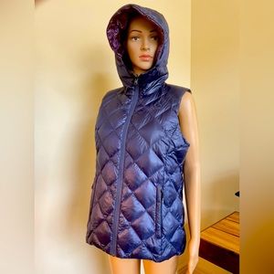 Purple reversible puff vest, large, with hood. Light weight and fits in a bag